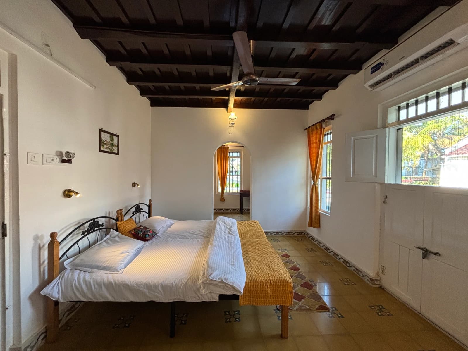 Tamarind Room — full room view with bed and natural light